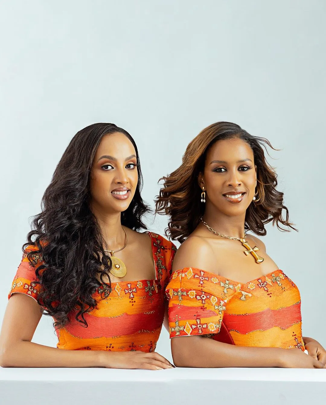 Radiant Elegance: Embrace the Splendor of Habesha Kemis - Vibrant Orange Ethiopian Dress